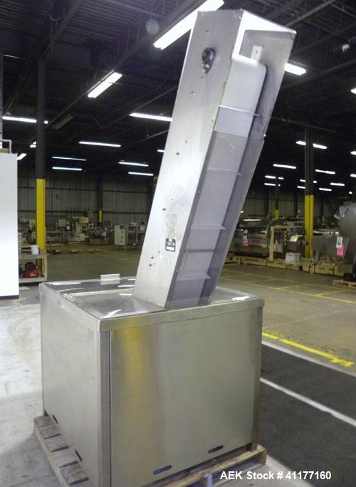 Used Omega Design feeder for Bottle Unscrambler,model H-1-18 bulk bottle elevator. Last running 15, 30, 60cc plastic bottles.