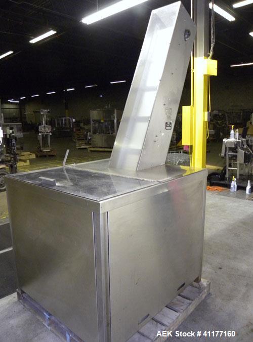 Used Omega Design feeder for Bottle Unscrambler,model H-1-18 bulk bottle elevator. Last running 15, 30, 60cc plastic bottles.
