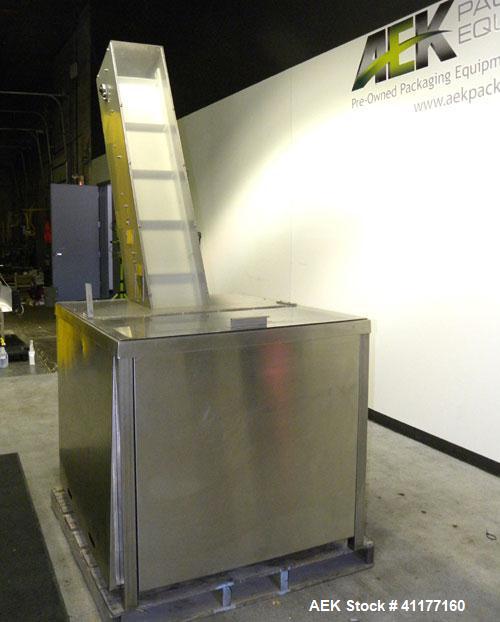 Used Omega Design feeder for Bottle Unscrambler,model H-1-18 bulk bottle elevator. Last running 15, 30, 60cc plastic bottles.