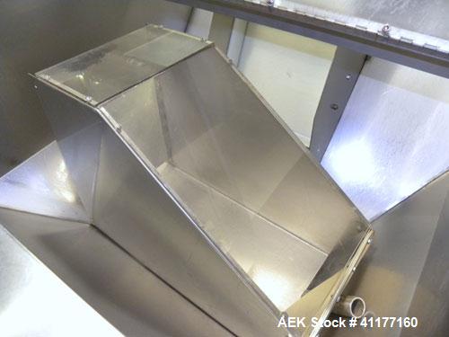 Used Omega Design feeder for Bottle Unscrambler,model H-1-18 bulk bottle elevator. Last running 15, 30, 60cc plastic bottles.