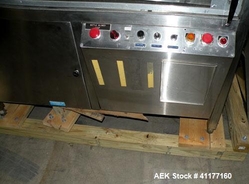 Used Omega Design feeder for Bottle Unscrambler,model H-1-18 bulk bottle elevator. Last running 15, 30, 60cc plastic bottles.
