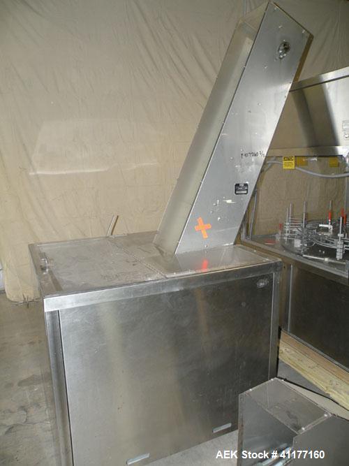 Used Omega Design feeder for Bottle Unscrambler,model H-1-18 bulk bottle elevator. Last running 15, 30, 60cc plastic bottles.
