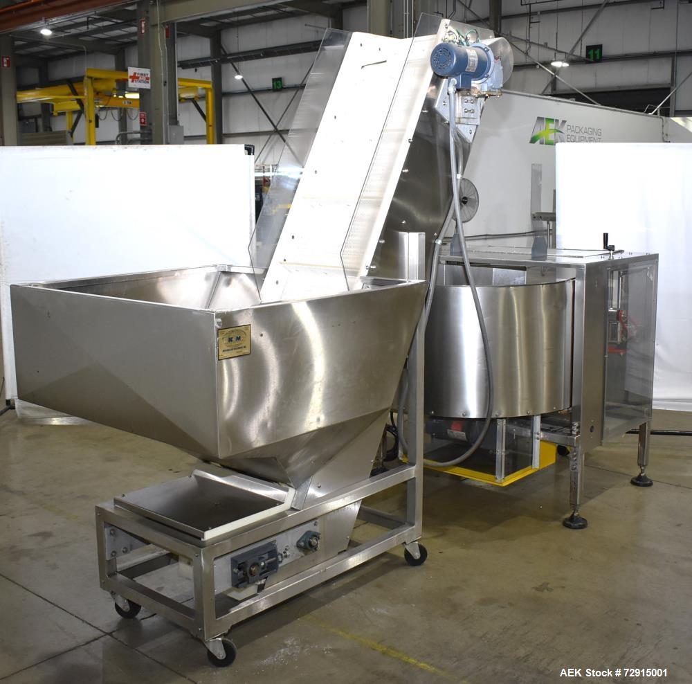 Used- Pace Packaging Bulk Bottle Unscrambler, Model M400. Capable of orienting approximately 20-350 bottles a minute, depend...