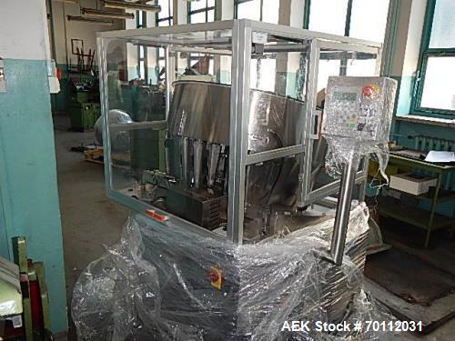 Used Ozaf Automatic Bottle Unscrambler, Model RO/1000. Speeds up to 110 bottles per minute. Ozaf E40V bottle hopper and elevator. Hopper capacity is 300 litres, level control in the hopper with low b...