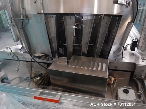 Used Ozaf Automatic Bottle Unscrambler, Model RO/1000. Speeds up to 110 bottles per minute. Ozaf E40V bottle hopper and elevator. Hopper capacity is 300 litres, level control in the hopper with low b...