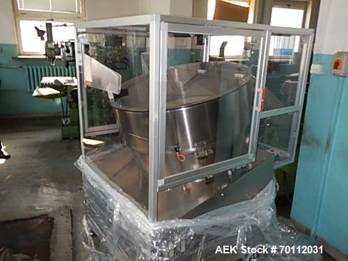 Used Ozaf Automatic Bottle Unscrambler, Model RO/1000. Speeds up to 110 bottles per minute. Ozaf E40V bottle hopper and elevator. Hopper capacity is 300 litres, level control in the hopper with low b...