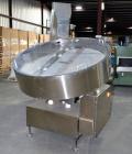 Used Ozaf AC/1500 Bottle Unscrambler, capacity approximately 170-180 units per minute. Includes an OZAF integrated elevator model E/10AG. SELLING PRICE AS IS, WHERE IS, SANFORD, NC.