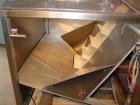 Used Kalish Bottle Unscrambler, model 7400, stainless steel. Feeds containers at up to 100 CPM, 42'' x 32'' x 22'' bulk hopper with 12'' x 28'' flighted rubber elevator belt, 3'' flights spaced 6'' o...