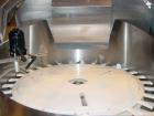 Used Kalish Bottle Unscrambler, model 7400, stainless steel. Feeds containers at up to 100 CPM, 42'' x 32'' x 22'' bulk hopper with 12'' x 28'' flighted rubber elevator belt, 3'' flights spaced 6'' o...