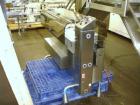 Used DT Kalish Kalisort 7400 bulk bottle unscrambler with DT Kalish model 999 inoized air cleaner bottle inverter and twin nozzle cleaning head, serial# 0001. (1) DT Kalish unscrambler, model 7400. I...