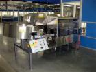 Used Kapsall Model AU6 bulk bottle unscrambler with integrated bottle elevator. Low profile design. Can Orient bottles from 1/16 oz to Gallons with proper changeparts. Last running 8/16 oz bottle wat...