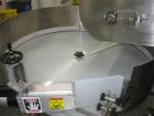 Used Kapsall Model AU6 bulk bottle unscrambler with integrated bottle elevator. Low profile design. Can Orient bottles from 1/16 oz to Gallons with proper changeparts. Last running 8/16 oz bottle wat...