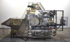 Used New England Machinery Model NEHCL-200AJ Bulk Bottle Unscrambler. Machine is capable of speeds up to 200 bottles per minute. Container size range: Diameter 5/8