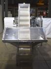 Used New England Machinery Model NEHCL-200AJ Bulk Bottle Unscrambler. Machine is capable of speeds up to 200 bottles per minute. Container size range: Diameter 5/8