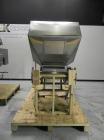 Used New England Model NEHCL-250AJ Bulk Bottle Unscrambler. Has integrated ionized air cleaner. Was last running 45 cc and 60 cc plastic pharmaceutical grade bottles. Includes New England model H/E-1...