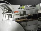 Used New England Model NEHCL-250AJ Bulk Bottle Unscrambler. Has integrated ionized air cleaner. Was last running 45 cc and 60 cc plastic pharmaceutical grade bottles. Includes New England model H/E-1...