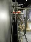 Used New England Model NEHCL-250AJ Bulk Bottle Unscrambler. Has integrated ionized air cleaner. Was last running 45 cc and 60 cc plastic pharmaceutical grade bottles. Includes New England model H/E-1...