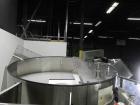 Used New England Model NEHCL-250AJ Bulk Bottle Unscrambler. Has integrated ionized air cleaner. Was last running 45 cc and 60 cc plastic pharmaceutical grade bottles. Includes New England model H/E-1...