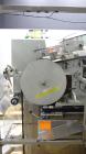 Used New England Machinery Model NEHCL-350 Bulk Bottle Unscrambler. Machine is capable of speeds up to 350 bottles per minute. Has a container size range of 5/8