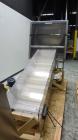 Used New England Machinery Model NEHCL-350 Bulk Bottle Unscrambler. Machine is capable of speeds up to 350 bottles per minute. Has a container size range of 5/8
