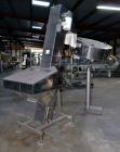 Used Mengibar 44” Diameter Bottle Unscrambler, Model MI-2, Serial #306015, Built 1997. Includes an integrated elevator, model EC300/2000, serial #306015. SELLING PRICE AS IS, WHERE IS, SANFORD, NC.