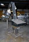Used Mengibar 44” Diameter Bottle Unscrambler, Model MI-2, Serial #306015, Built 1997. Includes an integrated elevator, model EC300/2000, serial #306015. SELLING PRICE AS IS, WHERE IS, SANFORD, NC.