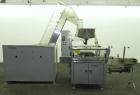 Used Omega Design Bottle Unscrambler, Model 2D1RPC8. 8 Station, Allen-Bradley SLC 5/03 PLC controls. Air cleaner, has Palace bottle elevator with 12