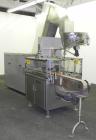 Used Omega Design Bottle Unscrambler, Model 2D1RPC8. 8 Station, Allen-Bradley SLC 5/03 PLC controls. Air cleaner, has Palace bottle elevator with 12