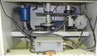 Used Omega Design Bottle Unscrambler, Model 2D1RPC8. 8 Station, Allen-Bradley SLC 5/03 PLC controls. Air cleaner, has Palace bottle elevator with 12