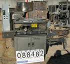 Used Omega Design Bottle Unscrambler, Model 2D1RPC8. 8 Station, Allen-Bradley SLC 5/03 PLC controls. Air cleaner, has Palace bottle elevator with 12