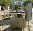Used Omega Design Bottle Unscrambler, Model 2D1RPC8. 8 Station, Allen-Bradley SLC 5/03 PLC controls. Air cleaner, has Palace bottle elevator with 12