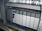 Used Omega Design Bottle Unscrambler, Model 2D1RPC8. 8 Station, Allen-Bradley SLC 5/03 PLC controls. Air cleaner, has Palace bottle elevator with 12