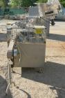 Used Omega Design Bottle Unscrambler, Model 2D1RPC8. 8 Station, Allen-Bradley SLC 5/03 PLC controls. Air cleaner, has Palace bottle elevator with 12