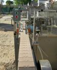 Used Omega Design Bottle Unscrambler, Model 2D1RPC8. 8 Station, Allen-Bradley SLC 5/03 PLC controls. Air cleaner, has Palace bottle elevator with 12