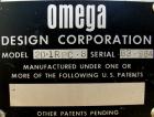 Used Omega Design Bottle Unscrambler, Model 2D1RPC8. 8 Station, Allen-Bradley SLC 5/03 PLC controls. Air cleaner, has Palace bottle elevator with 12
