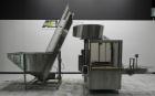 Used Omega Design Corp Model 4D-RP2-12 Bulk Bottle Unscrambler. Capable of speeds over 200 bottles per minute. Set up with 12 rotary pockets. Has 4' (48