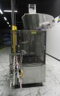 Used Omega Design Corp Model 4D-RP2-12 Bulk Bottle Unscrambler. Capable of speeds over 200 bottles per minute. Set up with 12 rotary pockets. Has 4' (48