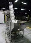 Used Omega Design Corp Model 4D-RP2-12 Bulk Bottle Unscrambler. Capable of speeds over 200 bottles per minute. Set up with 12 rotary pockets. Has 4' (48