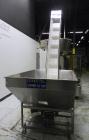 Used Omega Design Corp Model 4D-RP2-12 Bulk Bottle Unscrambler. Capable of speeds over 200 bottles per minute. Set up with 12 rotary pockets. Has 4' (48