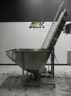 Used Omega Design Corp Model 4D-RP2-12 Bulk Bottle Unscrambler. Capable of speeds over 200 bottles per minute. Set up with 12 rotary pockets. Has 4' (48