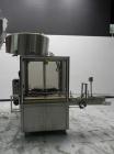 Used Omega Design Corp Model 4D-RP2-12 Bulk Bottle Unscrambler. Capable of speeds over 200 bottles per minute. Set up with 12 rotary pockets. Has 4' (48