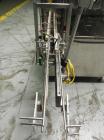 Used Omega Design Corp Model 4D-RP2-12 Bulk Bottle Unscrambler. Capable of speeds over 200 bottles per minute. Set up with 12 rotary pockets. Has 4' (48