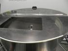 Used Omega Design Corp Model 4D-RP2-12 Bulk Bottle Unscrambler. Capable of speeds over 200 bottles per minute. Set up with 12 rotary pockets. Has 4' (48