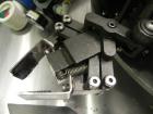 Used Omega Design Corp Model 4D-RP2-12 Bulk Bottle Unscrambler. Capable of speeds over 200 bottles per minute. Set up with 12 rotary pockets. Has 4' (48