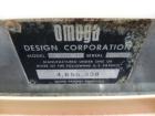Used Omega Design Corp Model 4D-RP2-12 Bulk Bottle Unscrambler. Capable of speeds over 200 bottles per minute. Set up with 12 rotary pockets. Has 4' (48