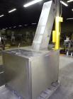 Used Omega Design feeder for Bottle Unscrambler,model H-1-18 bulk bottle elevator. Last running 15, 30, 60cc plastic bottles.