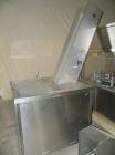 Used Omega Design feeder for Bottle Unscrambler,model H-1-18 bulk bottle elevator. Last running 15, 30, 60cc plastic bottles.