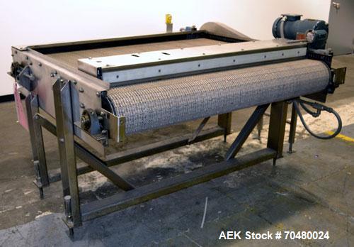 Used Nercon Accumulation Conveyor/Table, Stainless Steel. Approximate 60” wide x 48” long plastic belt with automatic push bar. Driven by a 1/2hp Reeves variable speed gear motor. Stainless steel fra...