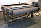 Used Nercon Accumulation Conveyor/Table, Stainless Steel. Approximate 60” wide x 48” long plastic belt with automatic push bar. Driven by a 1/2hp Reeves variable speed gear motor. Stainless steel fra...