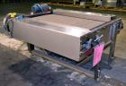 Used Nercon Accumulation Conveyor/Table, Stainless Steel. Approximate 60” wide x 48” long plastic belt with automatic push bar. Driven by a 1/2hp Reeves variable speed gear motor. Stainless steel fra...